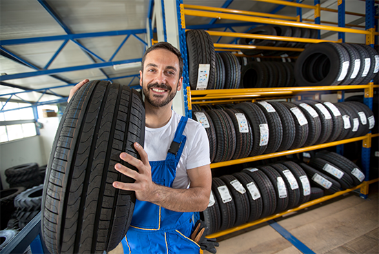 Man Holding a Tire